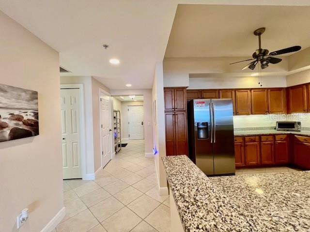 3333 Sunset Key Circle, Unit 303 Punta Gorda, FL 33955 - Photo 20 of 63 a large hall with stainless steel appliances kitchen island granite countertop a refrigerator and a sink