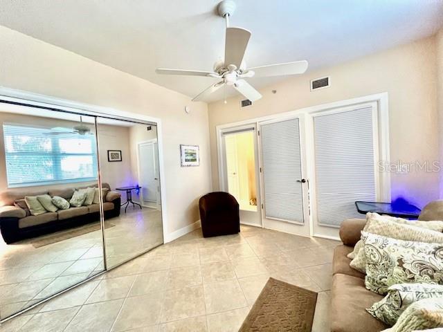 3333 Sunset Key Circle, Unit 303 Punta Gorda, FL 33955 - Photo 23 of 63 a bedroom with a bed and a couch