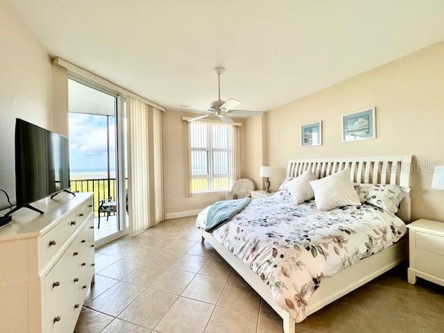 3333 Sunset Key Circle, Unit 303 Punta Gorda, FL 33955 - Photo 25 of 63 a bedroom with a bed and a flat screen tv