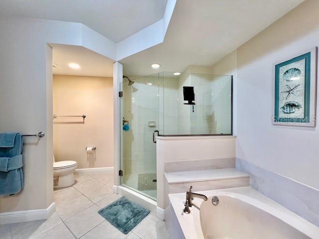 3333 Sunset Key Circle, Unit 303 Punta Gorda, FL 33955 - Photo 28 of 63 a bathroom with a sink a toilet and shower