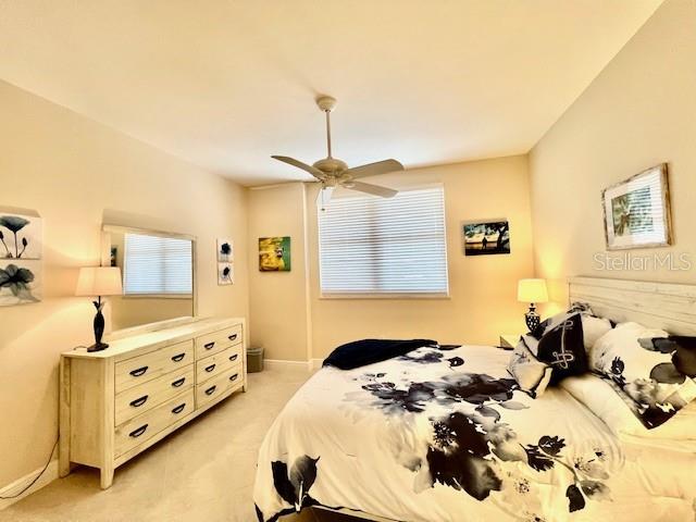 3333 Sunset Key Circle, Unit 303 Punta Gorda, FL 33955 - Photo 29 of 62 a bedroom with a bed and a dresser