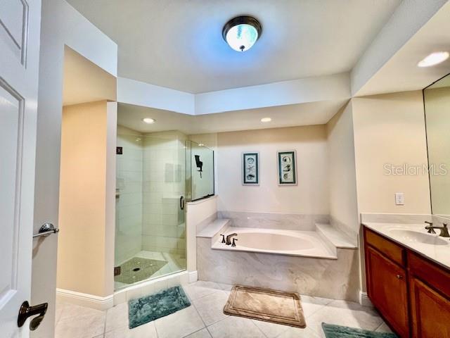 3333 Sunset Key Circle, Unit 303 Punta Gorda, FL 33955 - Photo 29 of 63 a bathroom with a tub sink shower and mirror