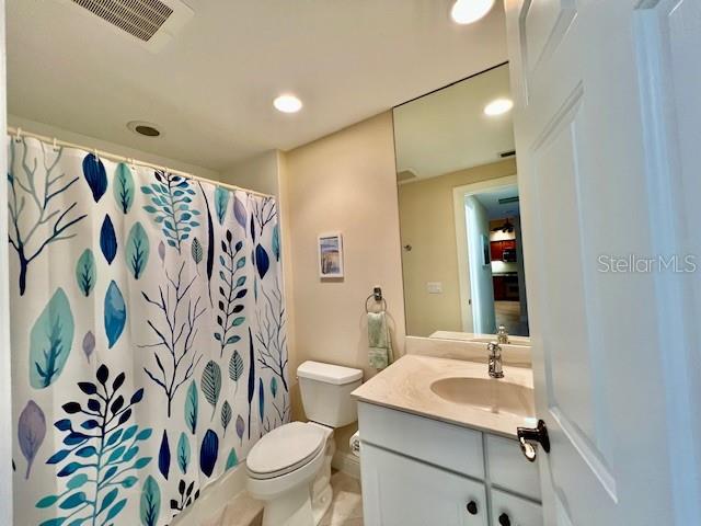 3333 Sunset Key Circle, Unit 303 Punta Gorda, FL 33955 - Photo 32 of 63 a bathroom with a sink and a mirror