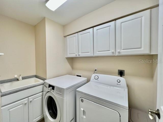 3333 Sunset Key Circle, Unit 303 Punta Gorda, FL 33955 - Photo 33 of 63 a utility room with dryer and washer