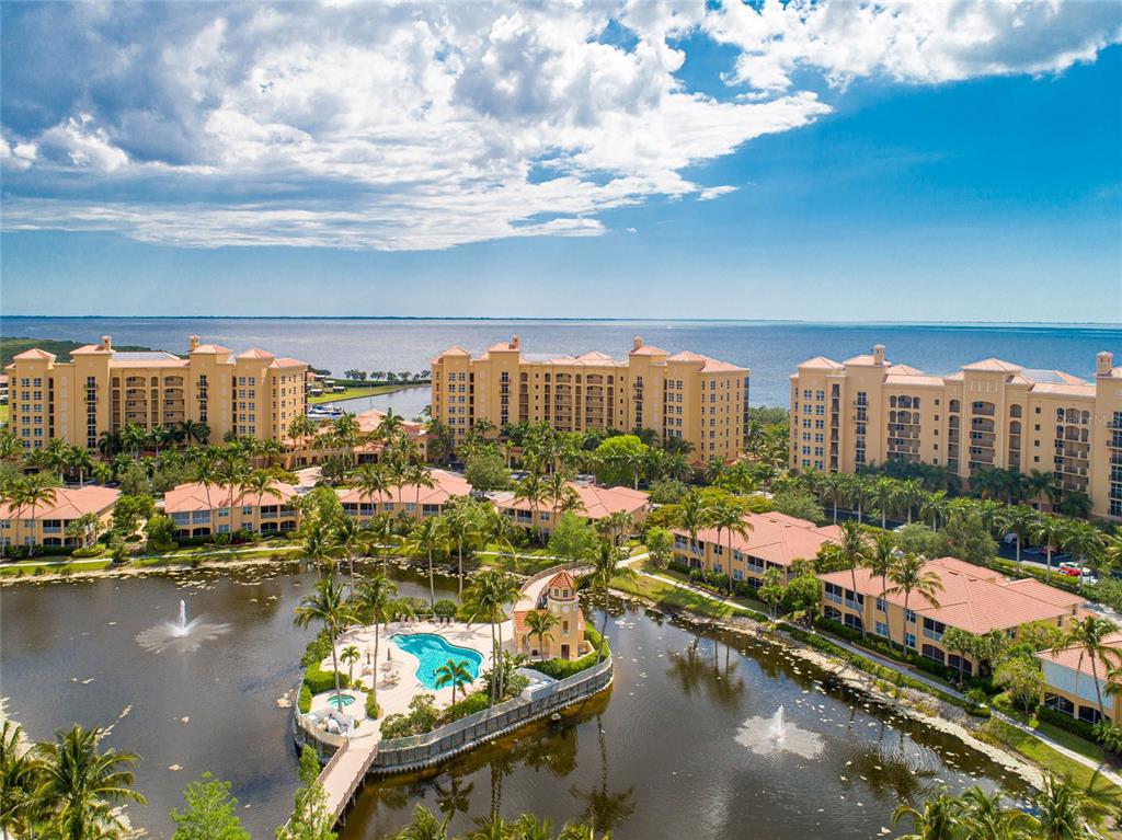 3333 Sunset Key Circle, Unit 303 Punta Gorda, FL 33955 - Photo 39 of 63 a city view with boat and palm trees