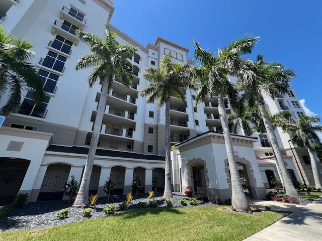 3333 Sunset Key Circle, Unit 303 Punta Gorda, FL 33955 - Photo 4 of 62 front view of a house with a yard