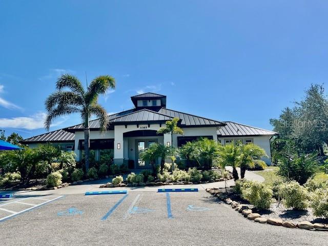 3333 Sunset Key Circle, Unit 303 Punta Gorda, FL 33955 - Photo 49 of 63 a front view of a house with plants