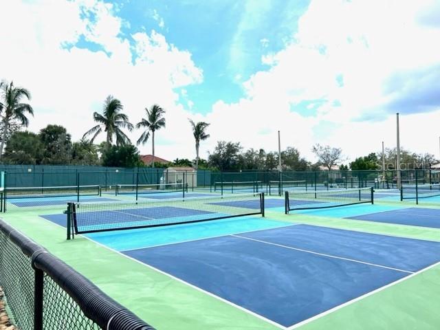 3333 Sunset Key Circle, Unit 303 Punta Gorda, FL 33955 - Photo 49 of 62 a view of an outdoor space and tennis court