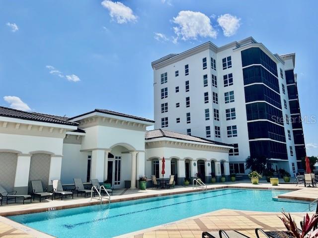 3333 Sunset Key Circle, Unit 303 Punta Gorda, FL 33955 - Photo 5 of 62 a view of a building with a swimming pool