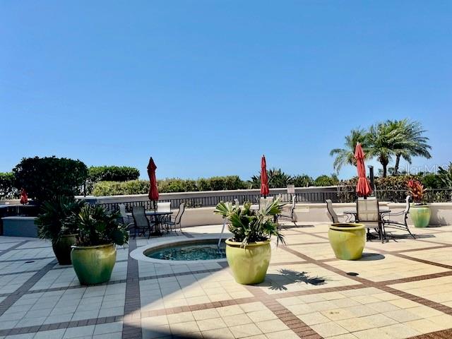 3333 Sunset Key Circle, Unit 303 Punta Gorda, FL 33955 - Photo 7 of 62 a view of swimming pool with outdoor seating and plants