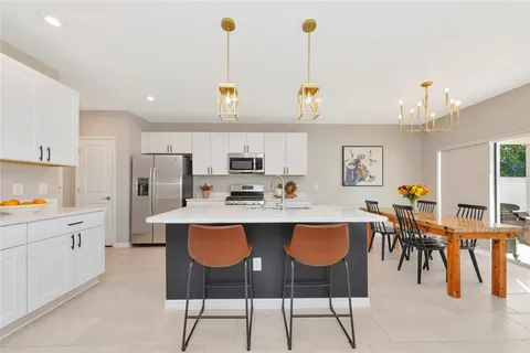 a kitchen with a sink and a refrigerator