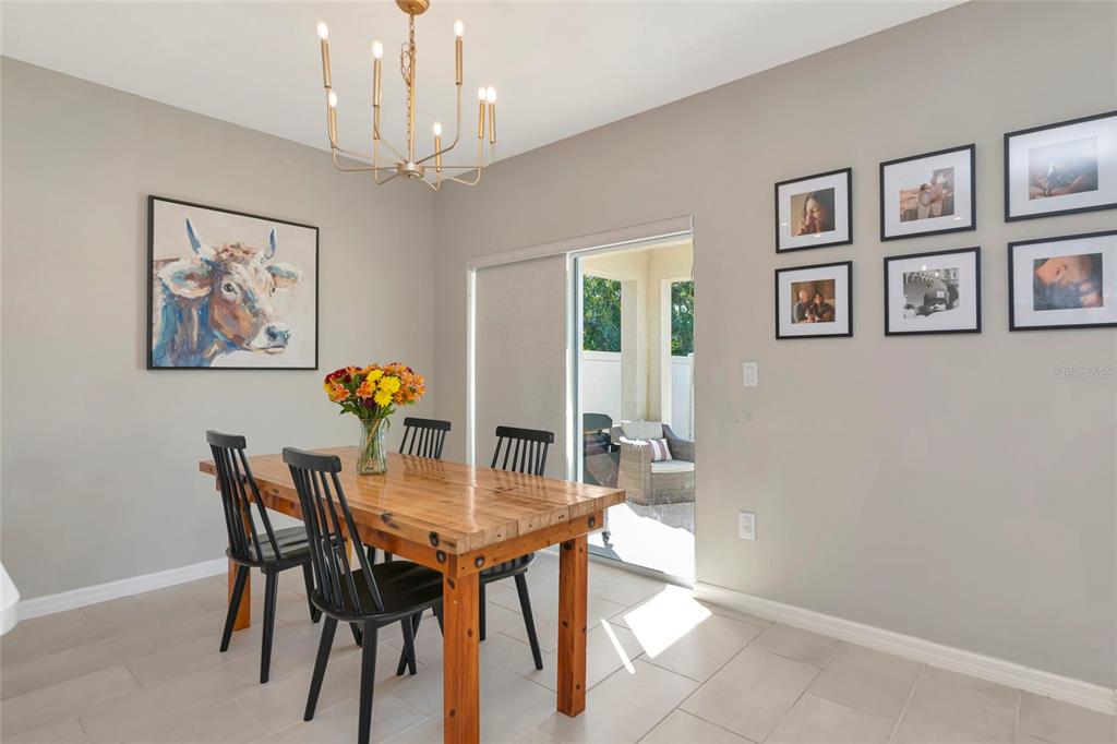 6283 Springmont Loop Palmetto, FL 34221 - Photo 23 of 68 a view of a dining room with furniture and chandelier