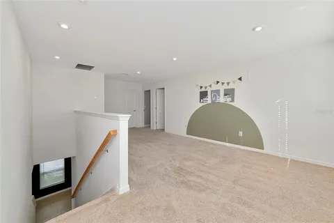 a bed room with a bed and a ceiling fan