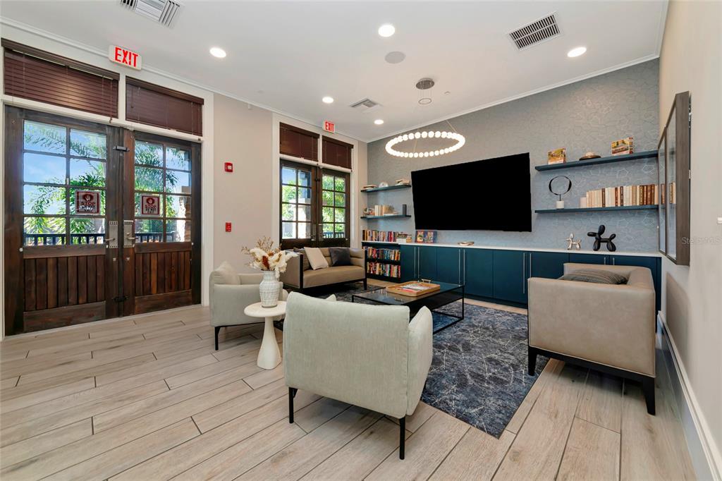 6283 Springmont Loop Palmetto, FL 34221 - Photo 60 of 68 a living room with furniture and a flat screen tv