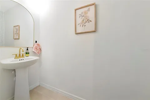 a living room with furniture and white walls