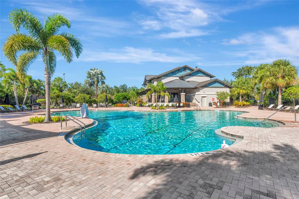 6283 Springmont Loop Palmetto, FL 34221 - Photo 65 of 68 a view of a house with swimming pool and a yard