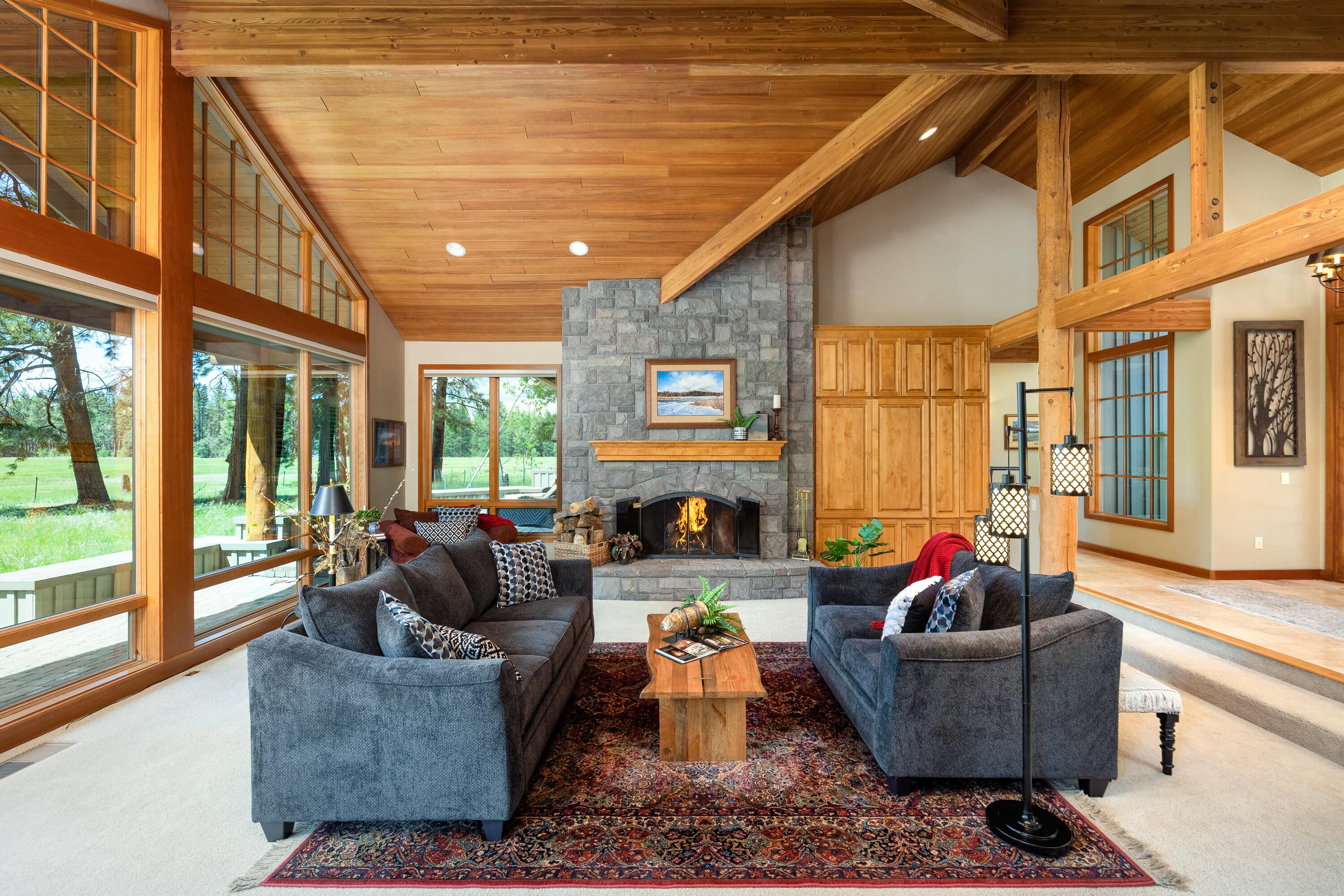 70331 Willow Herb, Unit GM205 Black Butte Ranch, OR 97759 - Photo 29 of 75 The Great Room has floor to ceiling windows and a custom hand cut basalt stone fireplace