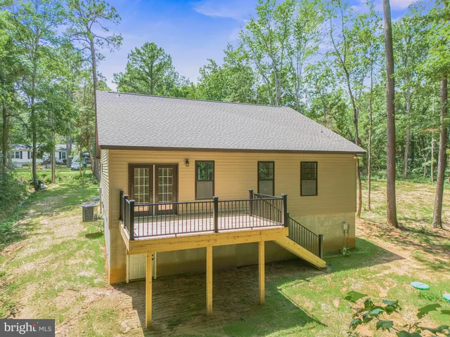 a balcony with table and chairs