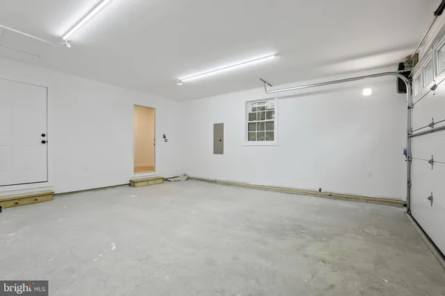 a view of a house with pool and sitting area