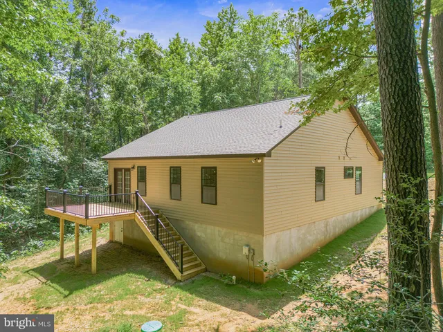 a view of a yard and deck