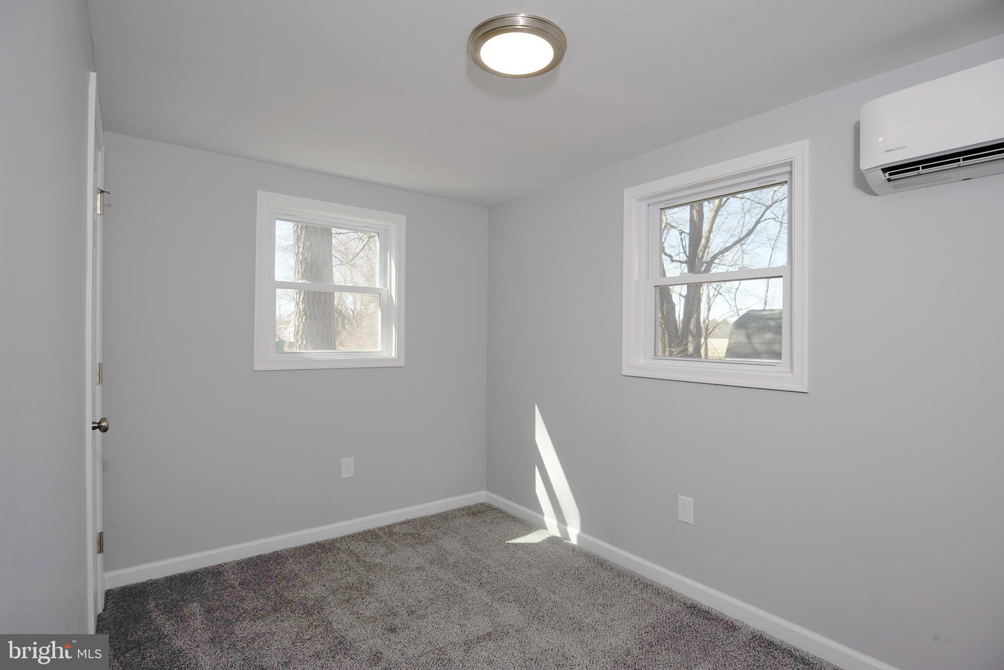 6374 Rock Hall Road Rock Hall, MD 21661 - Photo 13 of 34 an empty room with windows