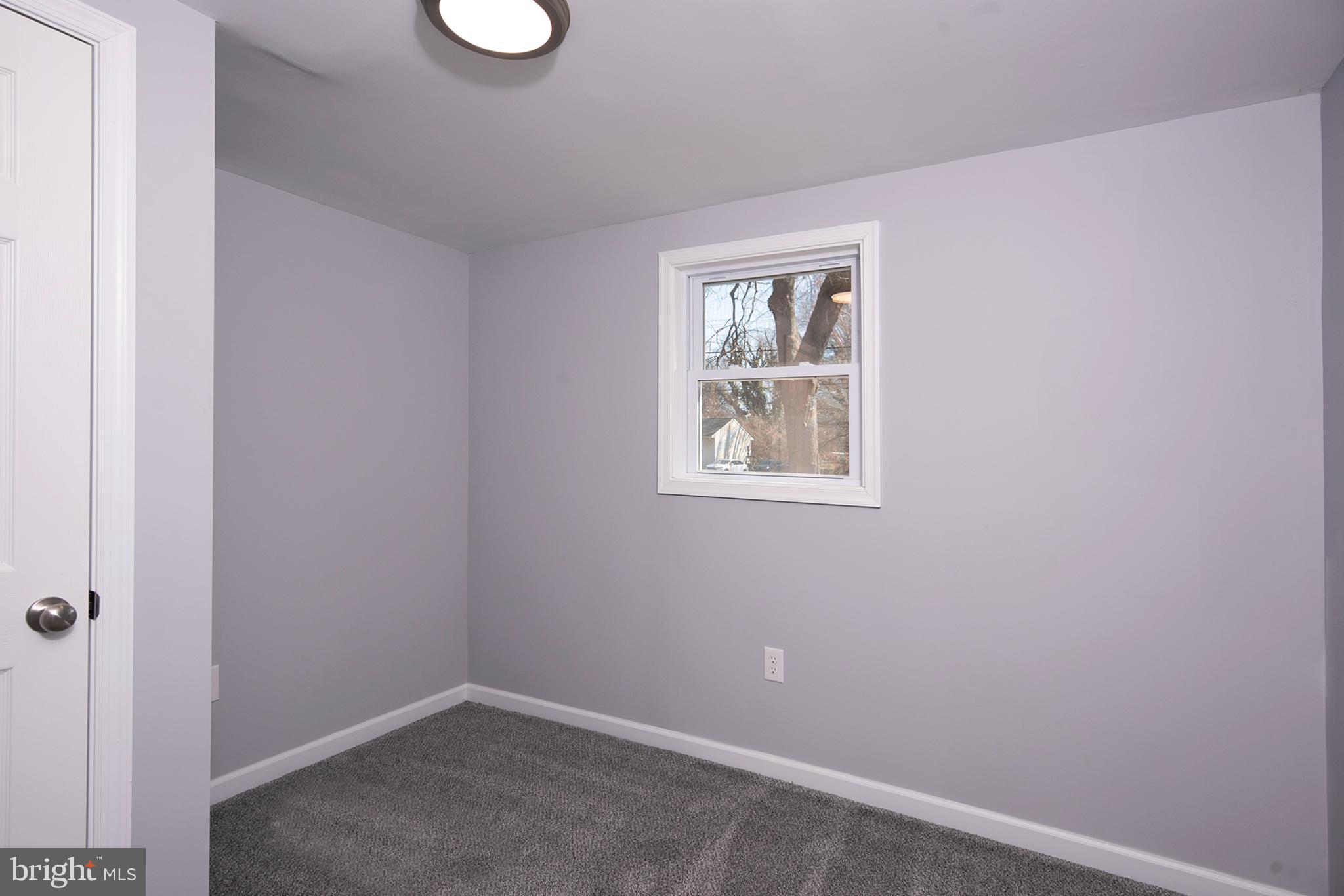 6374 Rock Hall Road Rock Hall, MD 21661 - Photo 15 of 34 an empty room with windows
