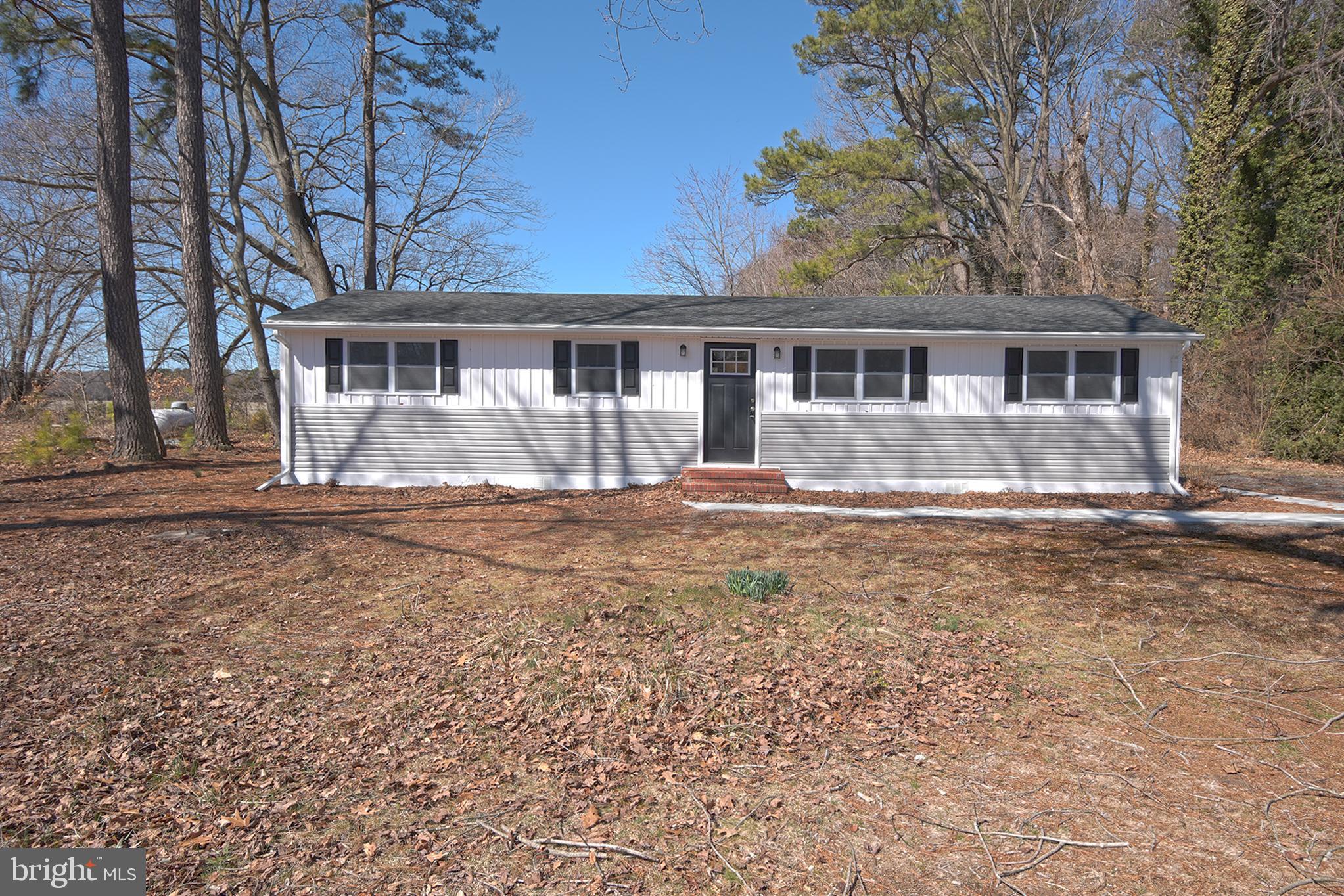 6374 Rock Hall Road Rock Hall, MD 21661 - Photo 34 of 34 a front view of a house with a yard