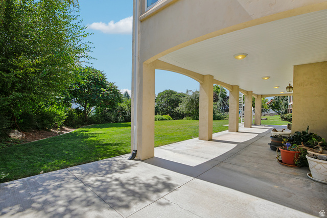 220 East Ridge Road Orem, UT 84057 - Photo 46 of 52 Expansive covered patio with arched columns and recessed lighting