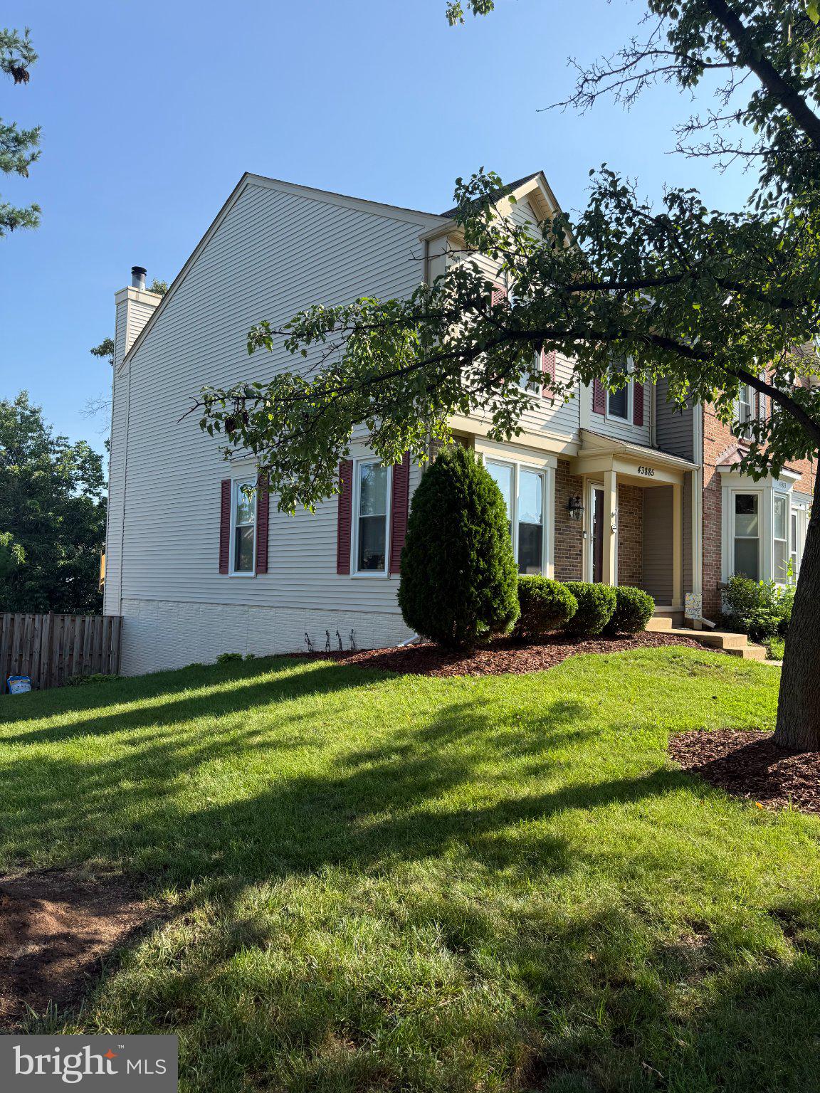 43885 Laburnum Square Ashburn, VA 20147 - Photo 2 of 2 Charming home with lush greenery.