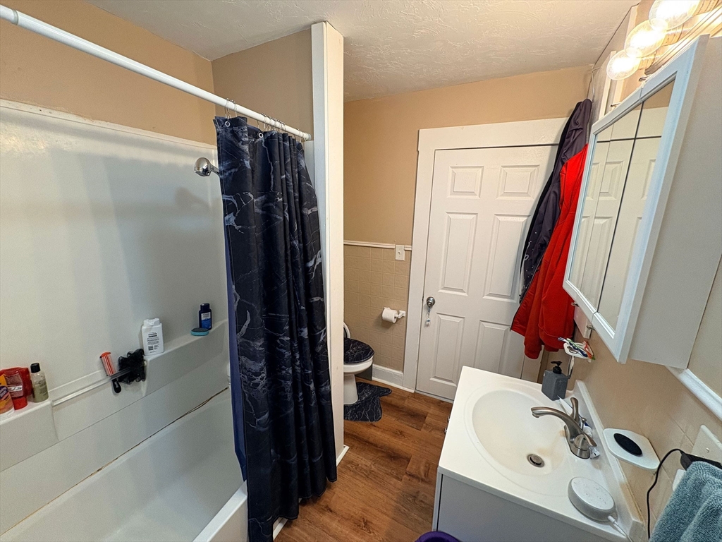 38 Greenacre Square, Unit 2 Springfield, MA 01105 - Photo 9 of 11 a bathroom with a tub sink and a mirror