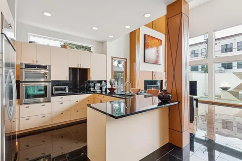 a kitchen with counter top space and stainless steel appliances