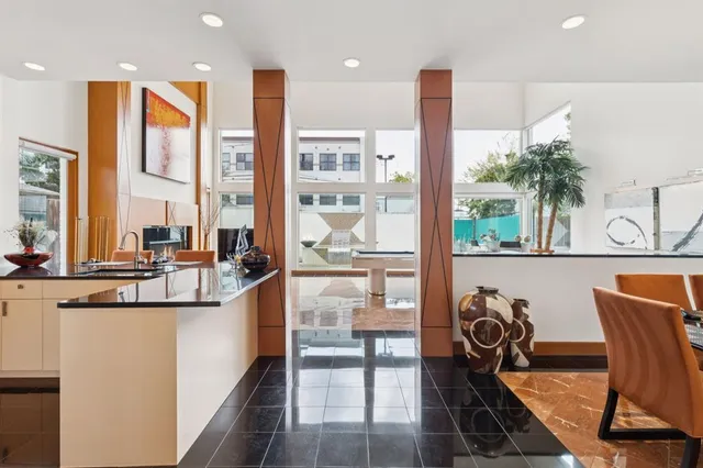 a view of a kitchen with kitchen island and a large window