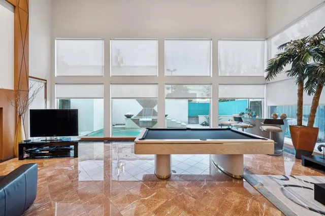 a living room with fireplace furniture and a flat screen tv