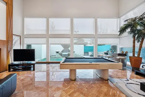 a living room with fireplace furniture and a flat screen tv