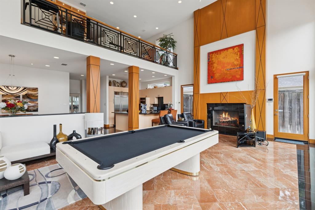 5730 West Amherst Avenue Dallas, TX 75209 - Photo 17 of 40 a living room with furniture a fireplace and a large window
