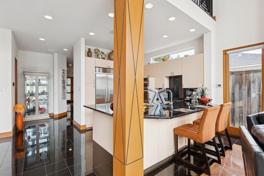 5730 West Amherst Avenue Dallas, TX 75209 - Photo 18 of 40 a view of a dining room with furniture and wooden floor