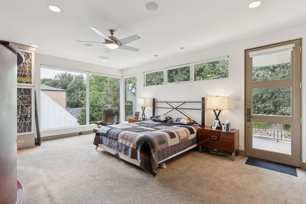 5730 West Amherst Avenue Dallas, TX 75209 - Photo 24 of 40 a spacious bedroom with a bed and a large window