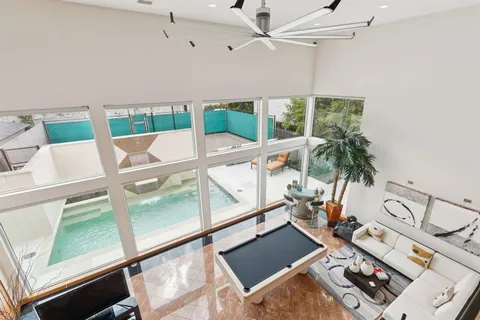 a spacious bedroom with a bed and a large window