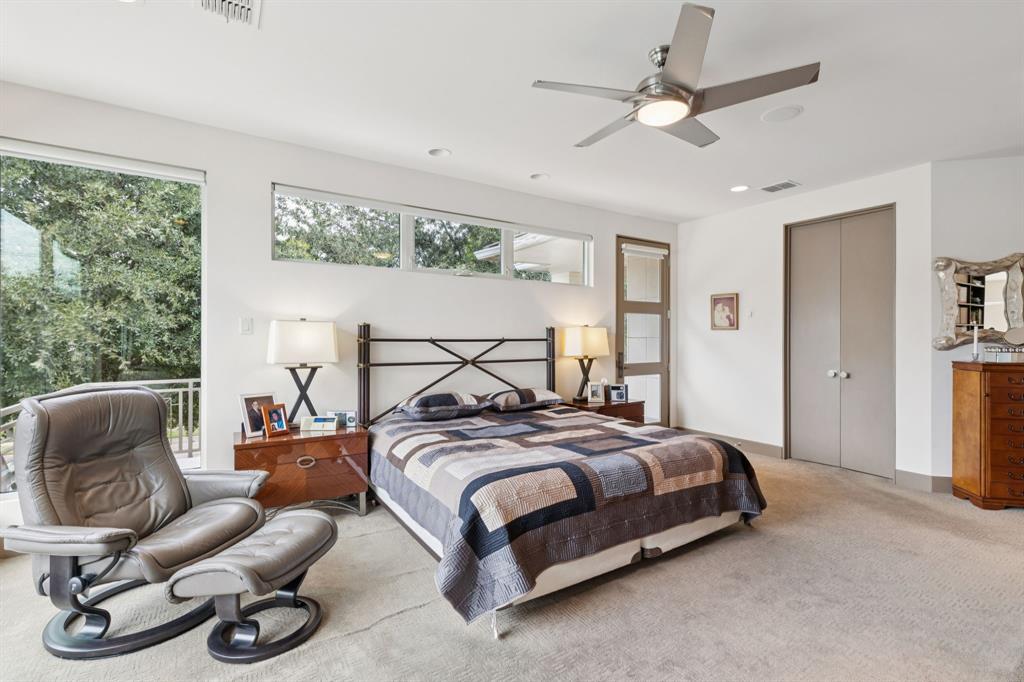 5730 West Amherst Avenue Dallas, TX 75209 - Photo 26 of 40 a bedroom with a bed a couch and a window