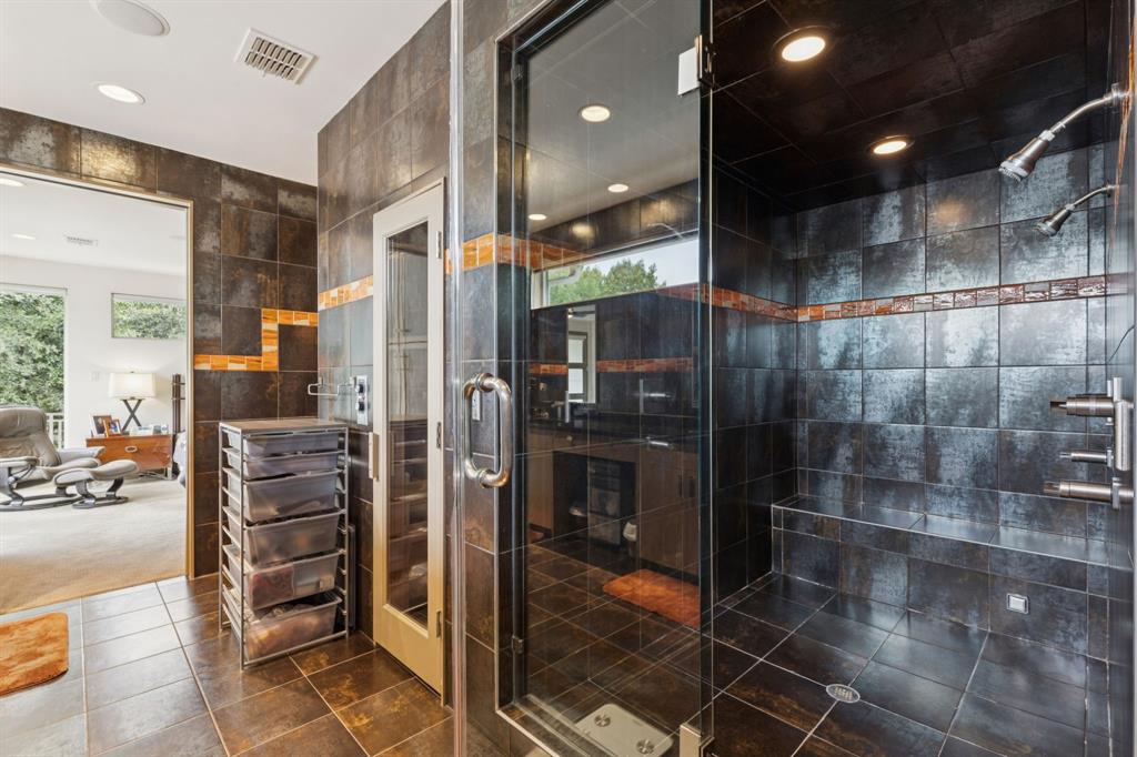 5730 West Amherst Avenue Dallas, TX 75209 - Photo 28 of 40 a bathroom with a glass shower door