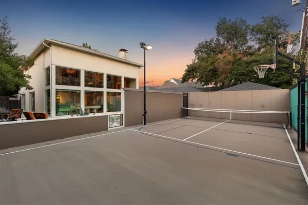 a swimming pool with outdoor seating and yard