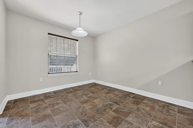 en empty room with windows