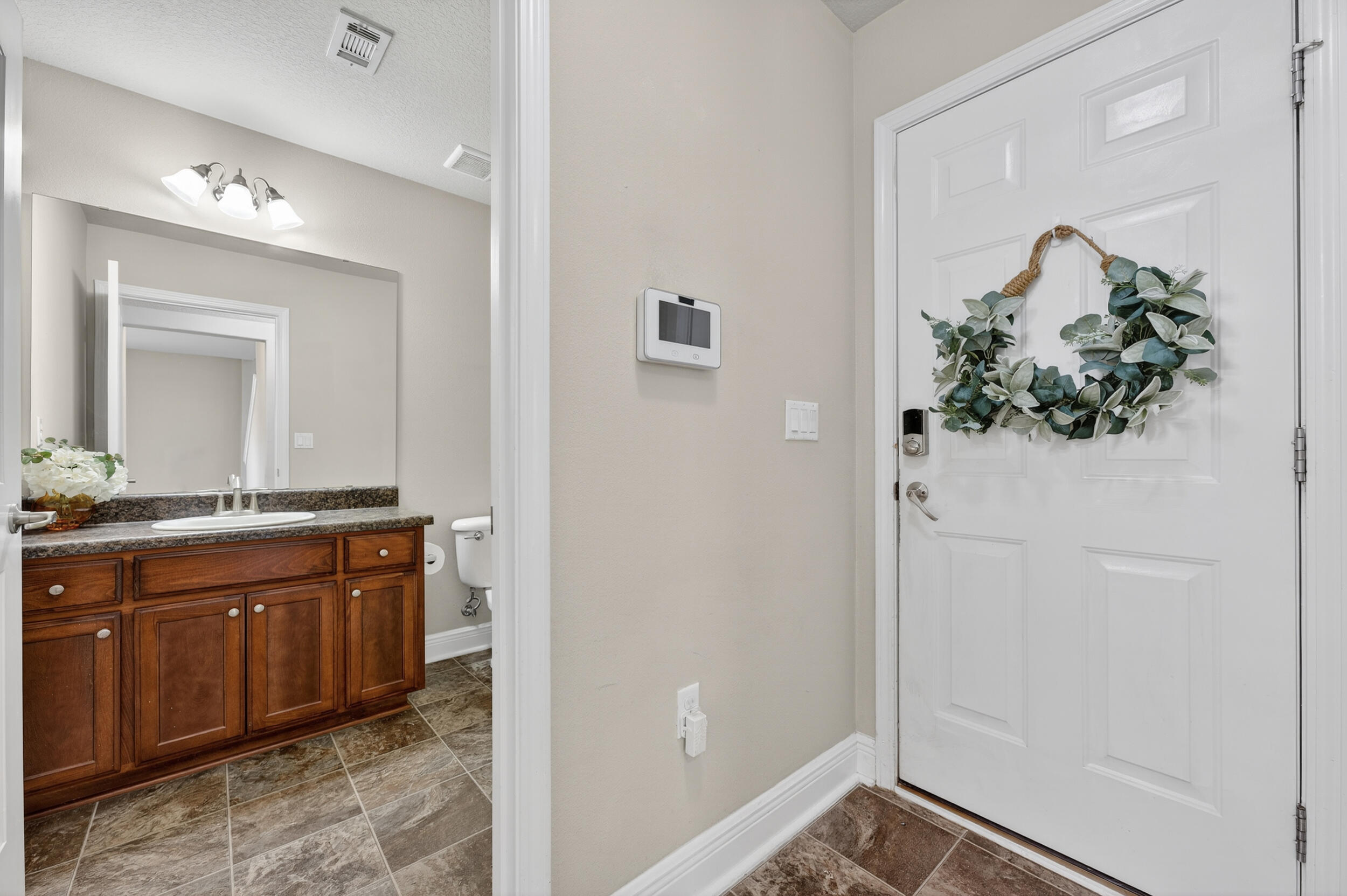 313 Gauntlet Drive Crestview, FL 32539 - Photo 18 of 44 a spacious bathroom with a sink and mirror