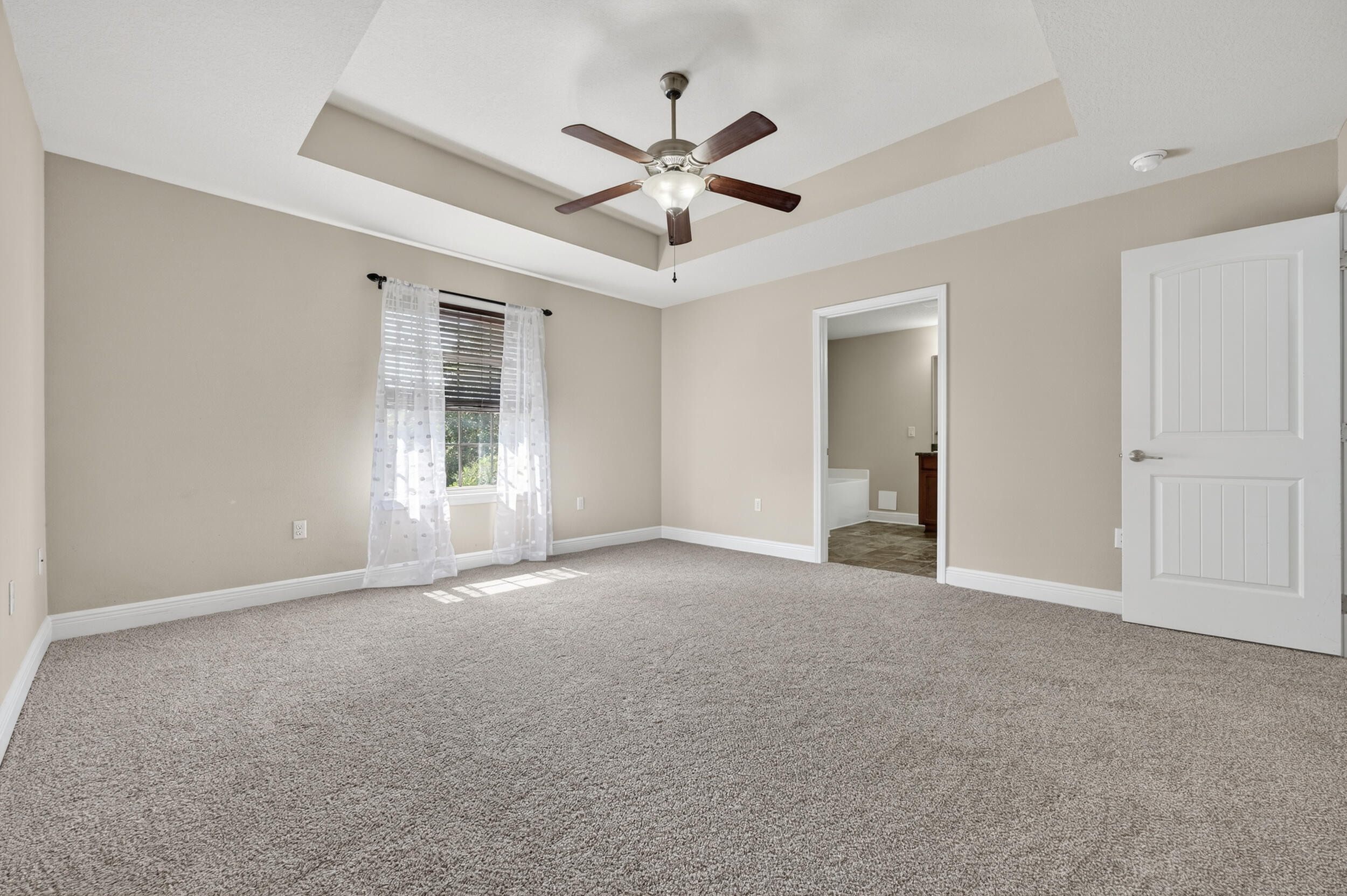 313 Gauntlet Drive Crestview, FL 32539 - Photo 25 of 44 an empty room with ceiling fan and window