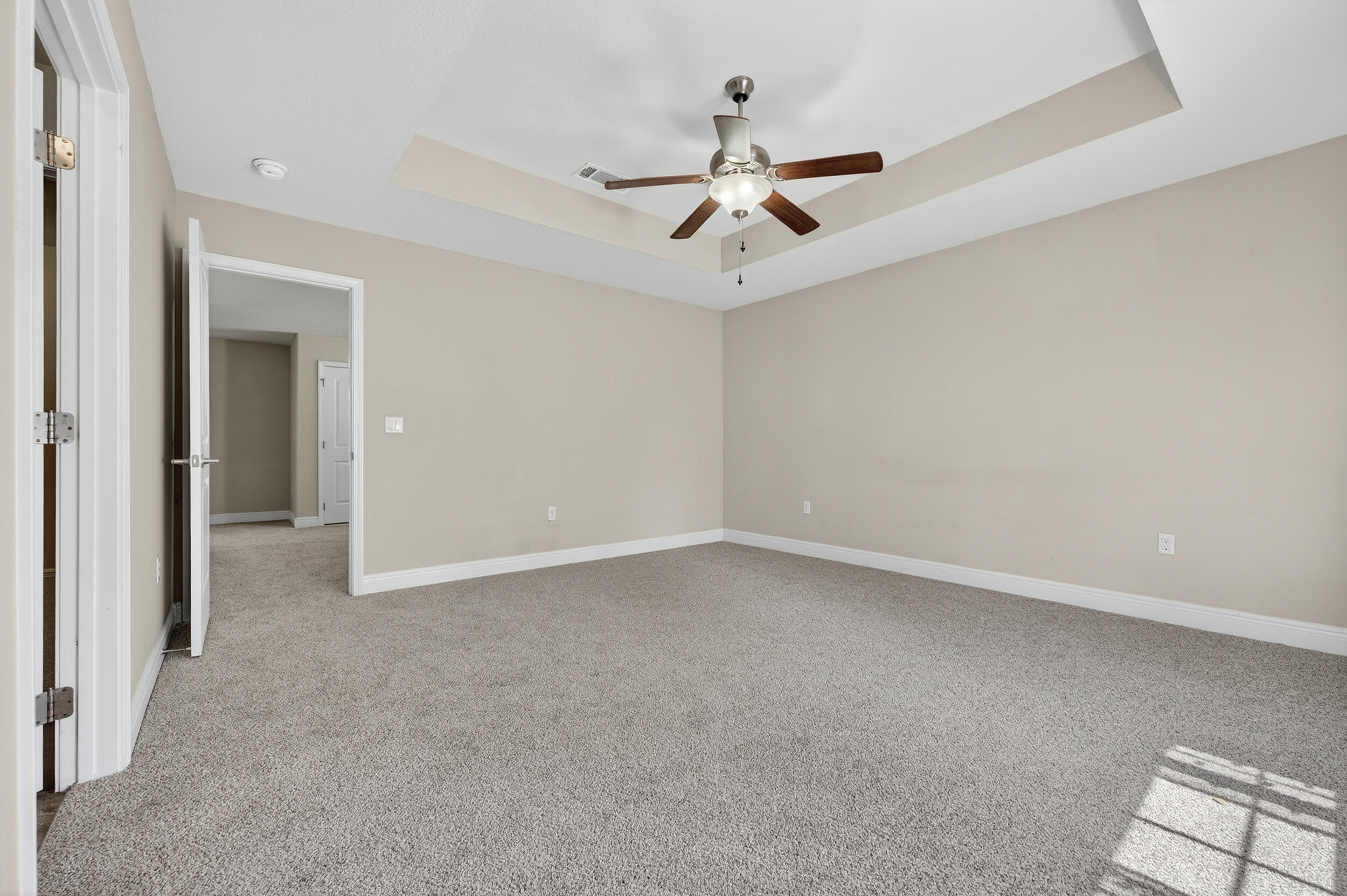 313 Gauntlet Drive Crestview, FL 32539 - Photo 26 of 44 an empty room with a ceiling fan and a window