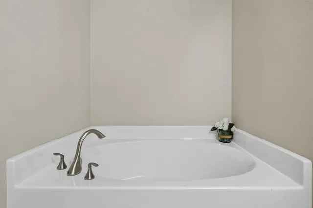 a white bath tub sitting in a bathroom