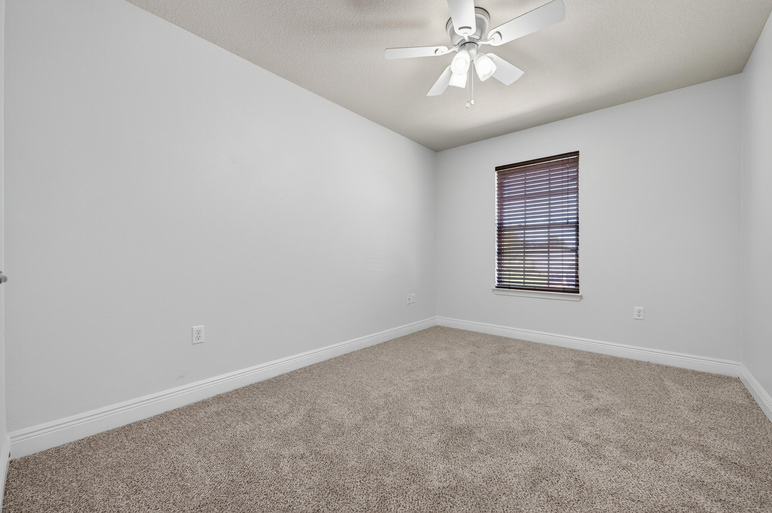 313 Gauntlet Drive Crestview, FL 32539 - Photo 31 of 44 an empty room with windows and fan