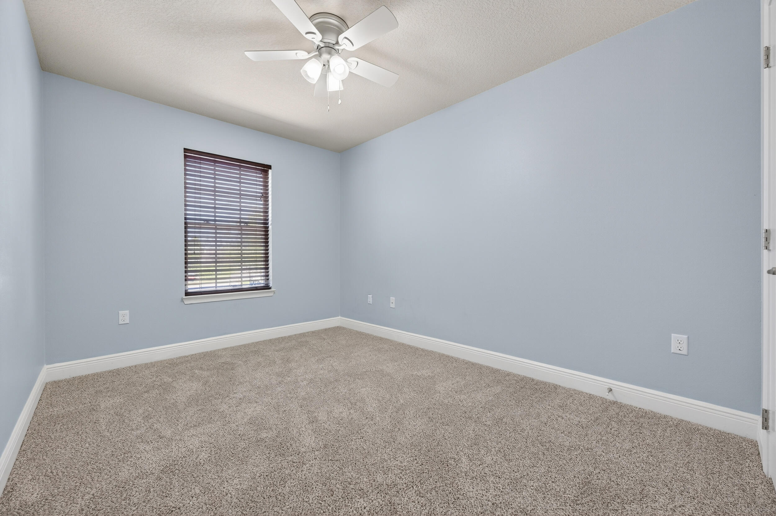 313 Gauntlet Drive Crestview, FL 32539 - Photo 33 of 44 an empty room with windows and fan