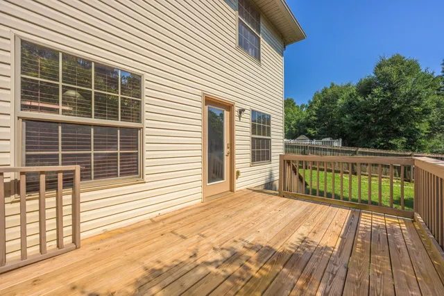 a view of a balcony with a floor to ceiling window