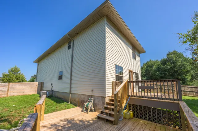 a view of a deck with a yard